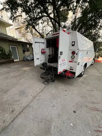 Magnet Plumbing service vehicle on-site for Water Heater Repair in McAfee